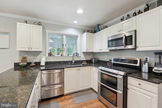 15118 Briarcliff Manor Way, Burtonsville, MD 20866 - kitchen featuring stainless steel appliances, ornamental molding, light wood finished floors, white cabinetry, and recessed lighting