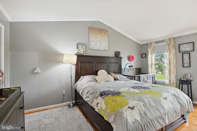 15118 Briarcliff Manor Way, Burtonsville, MD 20866 - bedroom featuring light wood finished floors, ornamental molding, and vaulted ceiling
