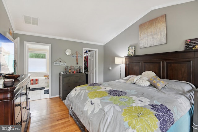 15118 Briarcliff Manor Way, Burtonsville, MD 20866 - bedroom featuring ornamental molding, light wood-style flooring, a spacious closet, lofted ceiling, and a closet