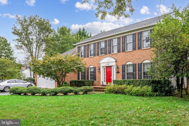 15118 Briarcliff Manor Way, Burtonsville, MD 20866 - view of front of property with an attached garage, brick siding, and a front lawn