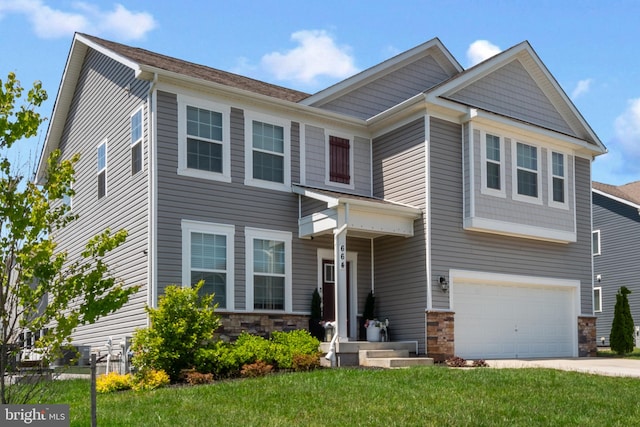 664 N Chandler Dr, Westminster, MD 21157 - view of front facade with a garage, stone siding, concrete driveway, and a front lawn