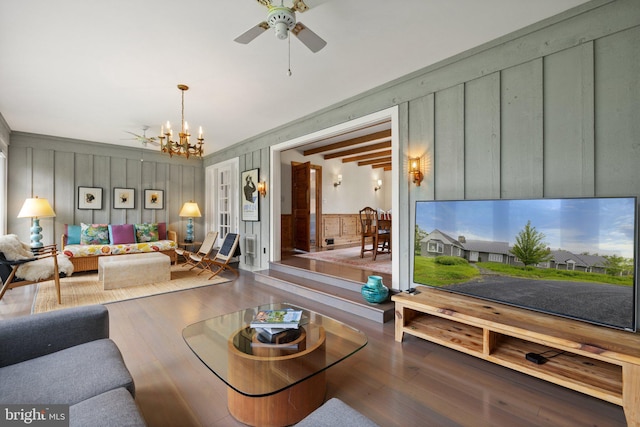 22693 St Louis Rd, Middleburg, VA 20117 - living room with wood finished floors, a chandelier, a ceiling fan, wooden walls, and a decorative wall