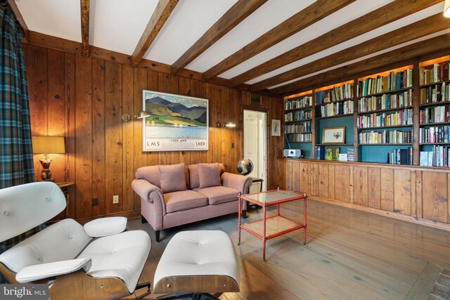 22693 St Louis Rd, Middleburg, VA 20117 - living area featuring wood walls, beam ceiling, and wood finished floors