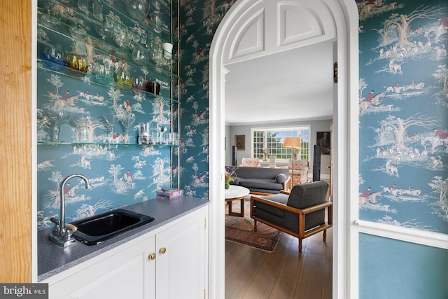 22693 St Louis Rd, Middleburg, VA 20117 - indoor wet bar featuring wood finished floors and ornamental molding