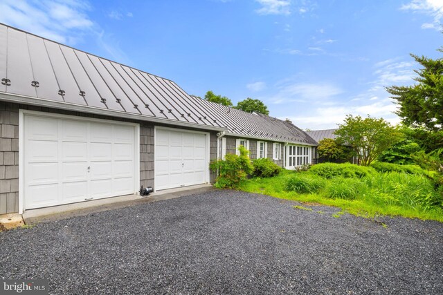 22693 St Louis Rd, Middleburg, VA 20117 - view of front of property with a standing seam roof, metal roof, and a garage