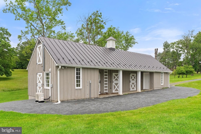 22693 St Louis Rd, Middleburg, VA 20117 - view of front of home with an outbuilding, a front yard, and a chimney