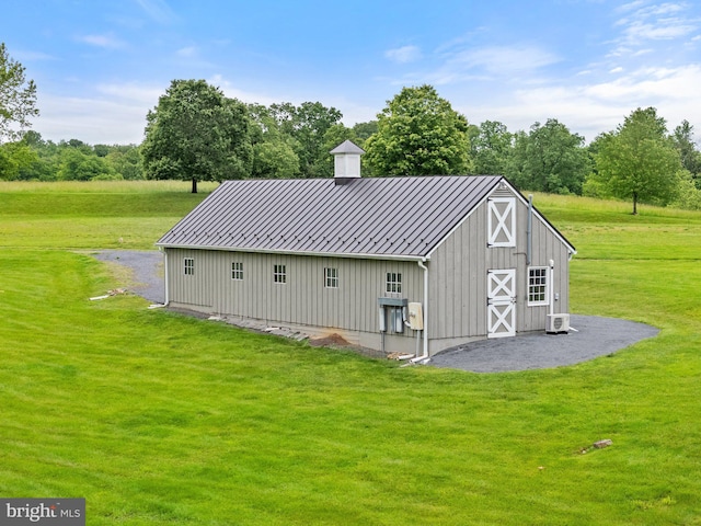 22693 St Louis Rd, Middleburg, VA 20117 - back of property with a yard, an outdoor structure, a standing seam roof, a barn, and metal roof