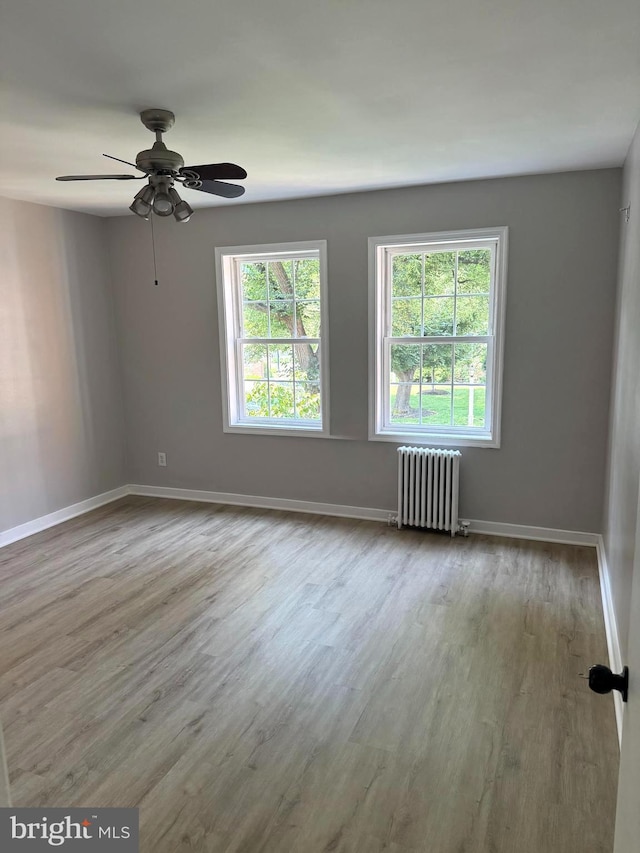 5104 Columbia Pike Unit 6, Arlington, VA 22204 - unfurnished room featuring radiator, wood finished floors, and ceiling fan