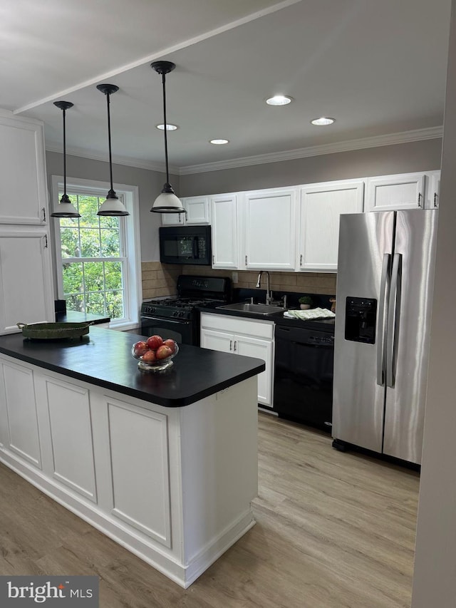 5104 Columbia Pike Unit 6, Arlington, VA 22204 - kitchen featuring black appliances, dark countertops, white cabinetry, crown molding, and recessed lighting