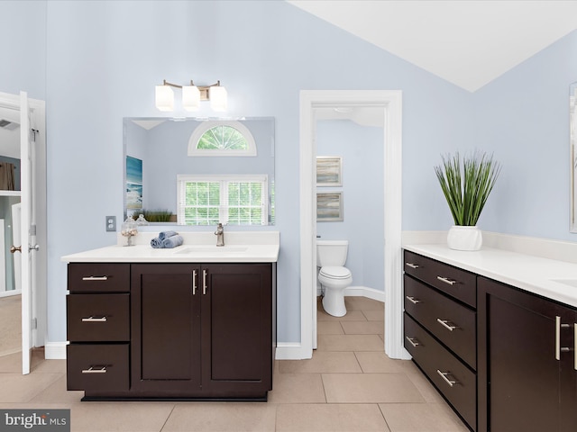 116 Colony Xing, Edgewater, MD 21037 - bathroom featuring two vanities, tile patterned flooring, toilet, high vaulted ceiling, and baseboards