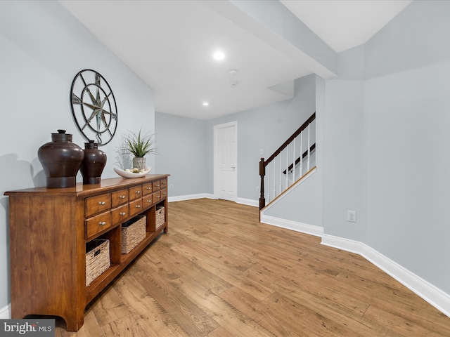 116 Colony Xing, Edgewater, MD 21037 - hall with light wood finished floors, baseboards, stairs, and recessed lighting
