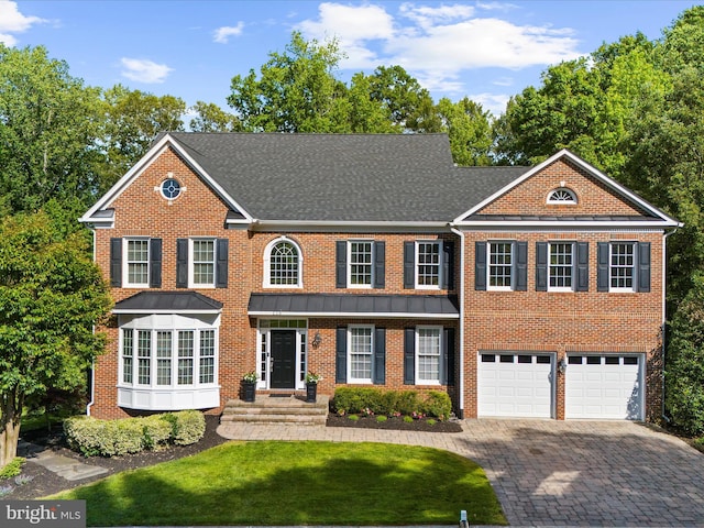 116 Colony Xing, Edgewater, MD 21037 - view of front of home with driveway, brick siding, a garage, and a front lawn