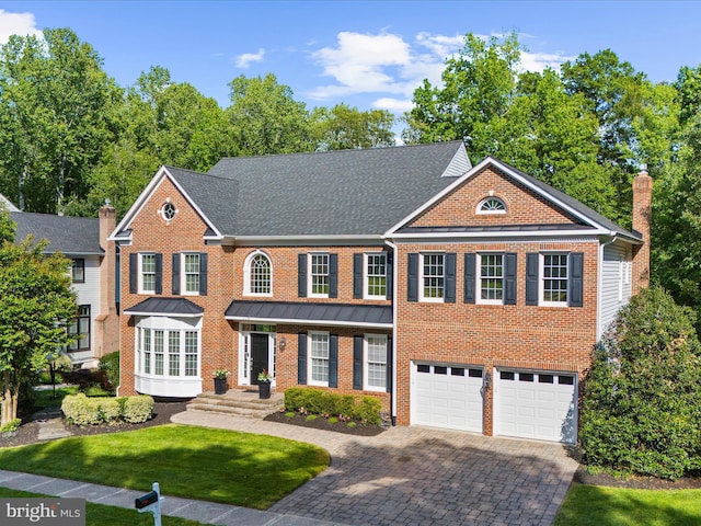 116 Colony Xing, Edgewater, MD 21037 - colonial house featuring driveway, brick siding, a garage, and a front yard