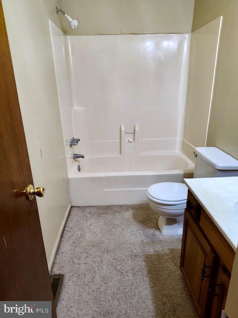 132 Popodickon Dr, Boyertown, PA 19512 - bathroom with toilet, vanity, shower / washtub combination, and carpet floors