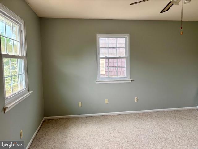 132 Popodickon Dr, Boyertown, PA 19512 - empty room with baseboards, carpet flooring, and a ceiling fan