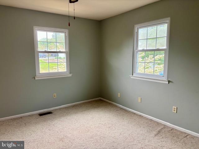 132 Popodickon Dr, Boyertown, PA 19512 - spare room featuring healthy amount of natural light, baseboards, and carpet flooring