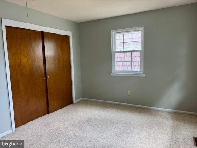 132 Popodickon Dr, Boyertown, PA 19512 - unfurnished bedroom featuring carpet, a closet, and baseboards