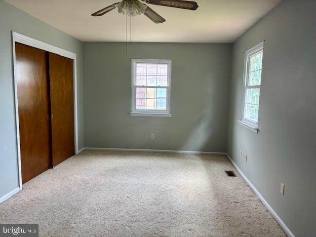 132 Popodickon Dr, Boyertown, PA 19512 - unfurnished bedroom with multiple windows, a closet, carpet floors, and baseboards