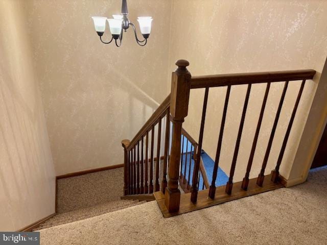 132 Popodickon Dr, Boyertown, PA 19512 - stairway featuring carpet flooring, a chandelier, and baseboards