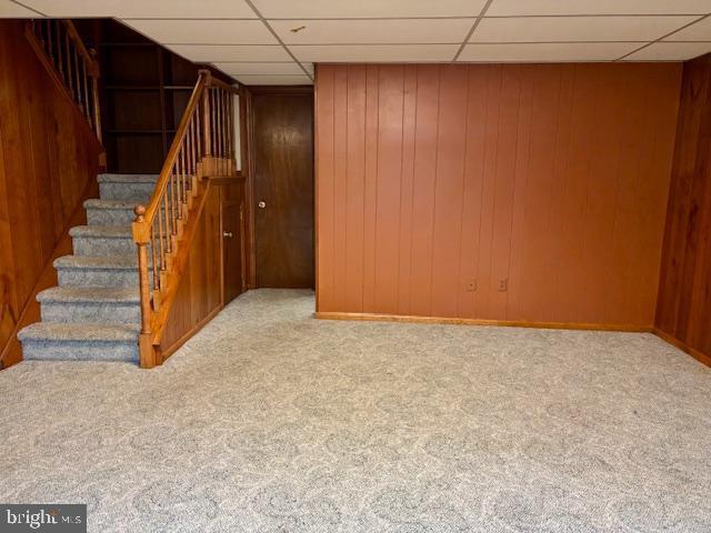 132 Popodickon Dr, Boyertown, PA 19512 - finished below grade area with stairs, carpet, a paneled ceiling, and wood walls