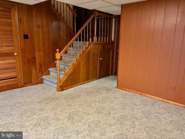 132 Popodickon Dr, Boyertown, PA 19512 - stairs with carpet flooring and wooden walls