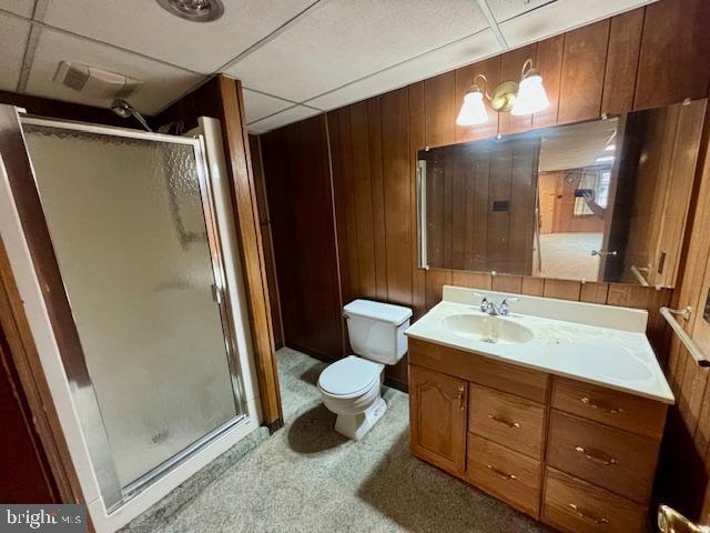 132 Popodickon Dr, Boyertown, PA 19512 - full bath featuring a shower stall, toilet, vanity, and wooden walls