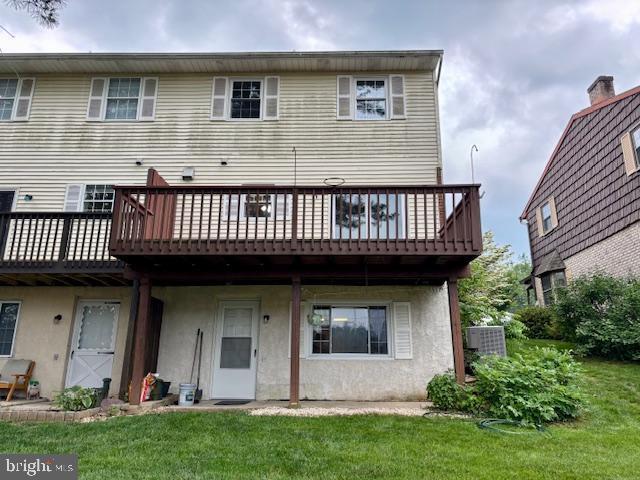 132 Popodickon Dr, Boyertown, PA 19512 - rear view of house with a yard, stucco siding, and a wooden deck