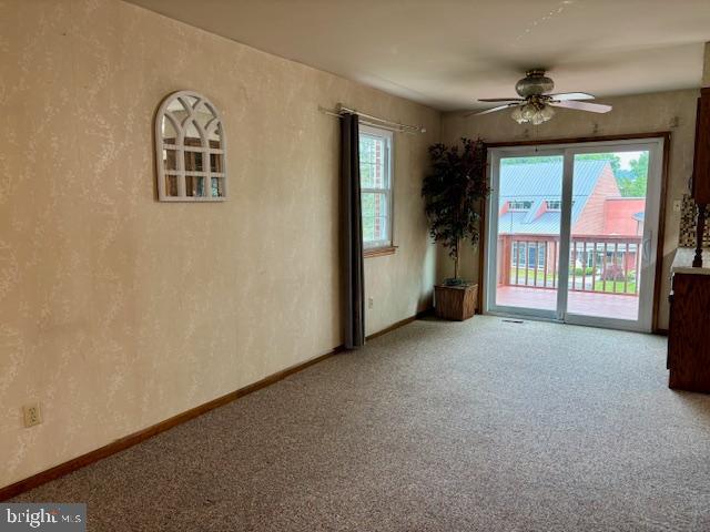 132 Popodickon Dr, Boyertown, PA 19512 - empty room with carpet flooring, a ceiling fan, baseboards, and a textured wall