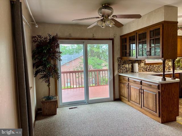 132 Popodickon Dr, Boyertown, PA 19512 - doorway to outside with ceiling fan and light colored carpet