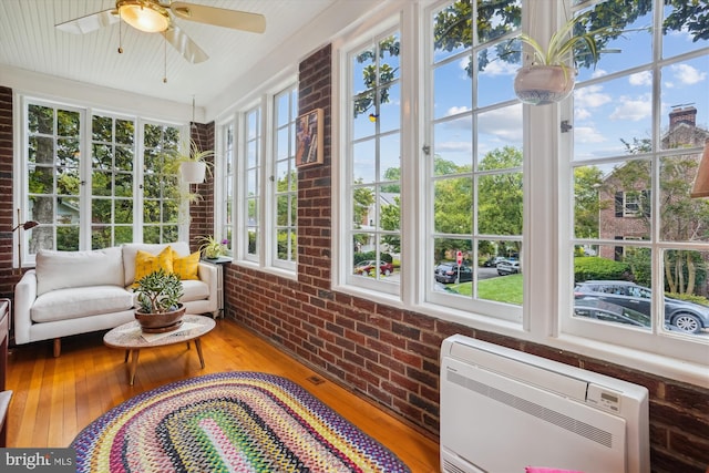 402 W Masonic View Ave, Alexandria, VA 22301 - sunroom featuring brick wall, hardwood / wood-style floors, heating unit, french doors, and a wall mounted air conditioner