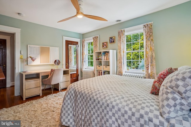 402 W Masonic View Ave, Alexandria, VA 22301 - bedroom featuring wood finished floors, radiator heating unit, and a ceiling fan