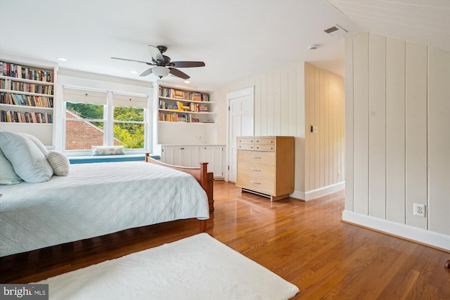 402 W Masonic View Ave, Alexandria, VA 22301 - bedroom featuring light wood-style floors, ceiling fan, baseboards, and wooden walls
