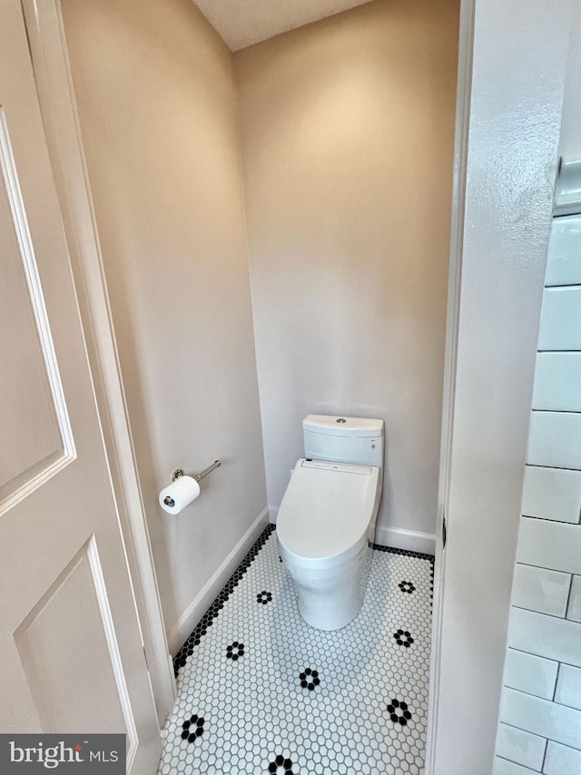 402 W Masonic View Ave, Alexandria, VA 22301 - bathroom with toilet, tile patterned flooring, and baseboards