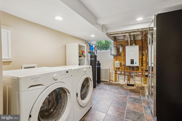 402 W Masonic View Ave, Alexandria, VA 22301 - laundry room with washing machine and dryer, tankless water heater, recessed lighting, radiator, and dark stone finish flooring