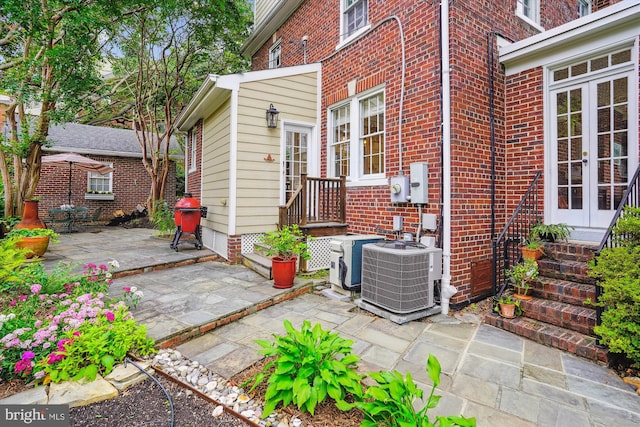 402 W Masonic View Ave, Alexandria, VA 22301 - view of patio / terrace featuring central air condition unit, french doors, and area for grilling