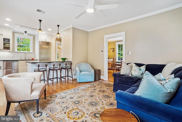 402 W Masonic View Ave, Alexandria, VA 22301 - living room with ornamental molding, light wood-style flooring, a ceiling fan, recessed lighting, and baseboards