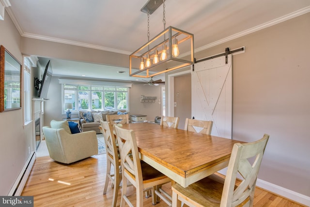 1606 Jeffers Rd, Baltimore, MD 21204 - dining space featuring baseboard heating, a barn door, light wood-style flooring, ornamental molding, and ceiling fan