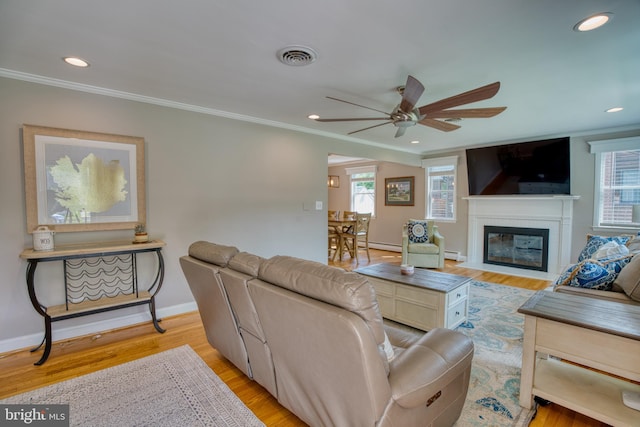 1606 Jeffers Rd, Baltimore, MD 21204 - living area with a ceiling fan, crown molding, light wood-style flooring, a fireplace with flush hearth, and baseboards