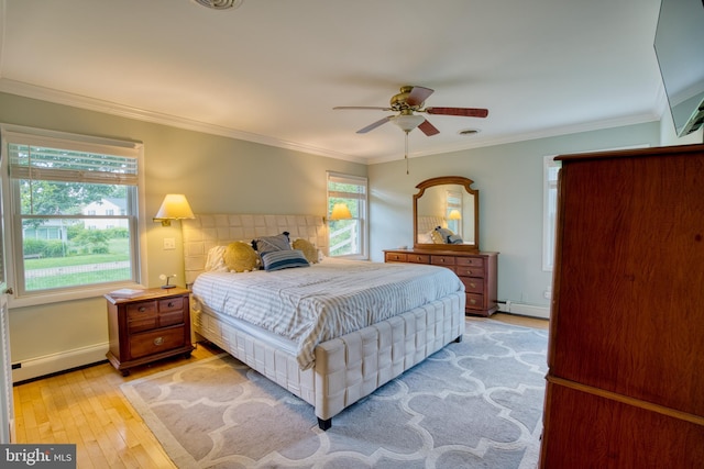 1606 Jeffers Rd, Baltimore, MD 21204 - bedroom featuring a baseboard radiator, light wood-style floors, crown molding, baseboard heating, and baseboards