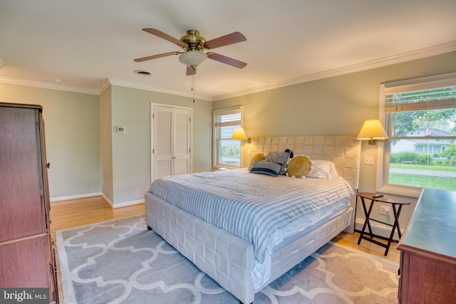 1606 Jeffers Rd, Baltimore, MD 21204 - bedroom featuring light wood-style flooring, a closet, crown molding, ceiling fan, and baseboards