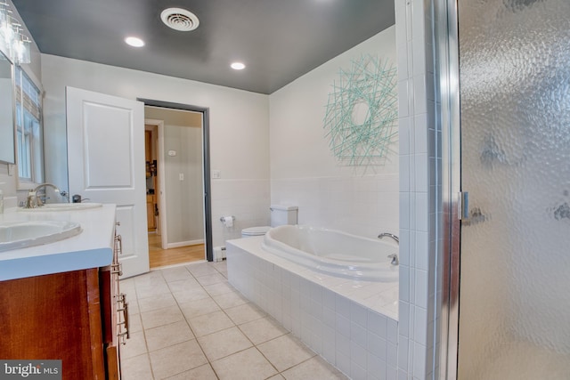1606 Jeffers Rd, Baltimore, MD 21204 - full bathroom with tile patterned flooring, double vanity, a garden tub, a stall shower, and recessed lighting