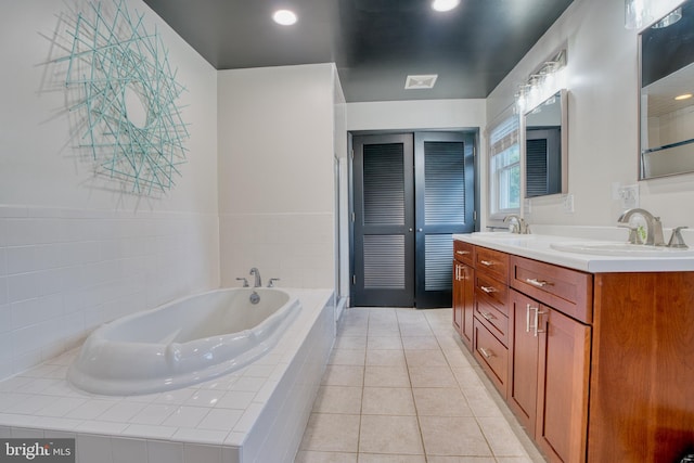 1606 Jeffers Rd, Baltimore, MD 21204 - full bathroom with a bath, double vanity, and tile patterned flooring