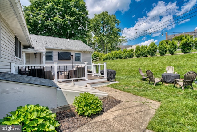 1606 Jeffers Rd, Baltimore, MD 21204 - view of green lawn featuring a wooden deck and an outdoor fire pit