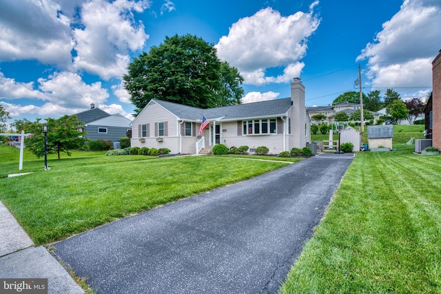 1606 Jeffers Rd, Baltimore, MD 21204 - ranch-style home with cooling unit, a chimney, and a front lawn