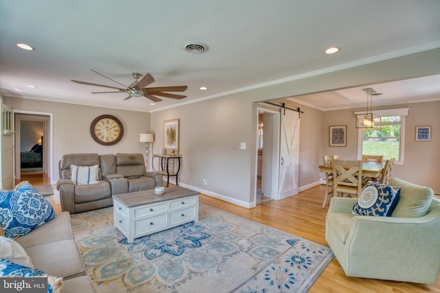 1606 Jeffers Rd, Baltimore, MD 21204 - living area with a barn door, ceiling fan, light wood-type flooring, ornamental molding, and baseboards