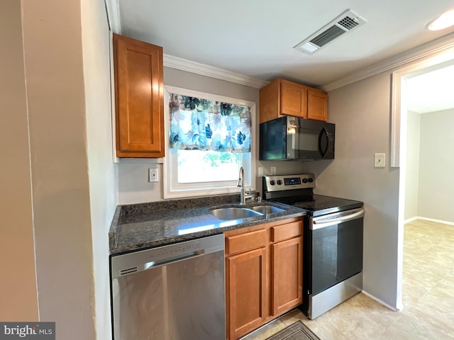 131 Arundel Rd, Pasadena, MD 21122 - kitchen featuring appliances with stainless steel finishes, a sink, dark stone counters, brown cabinetry, and ornamental molding