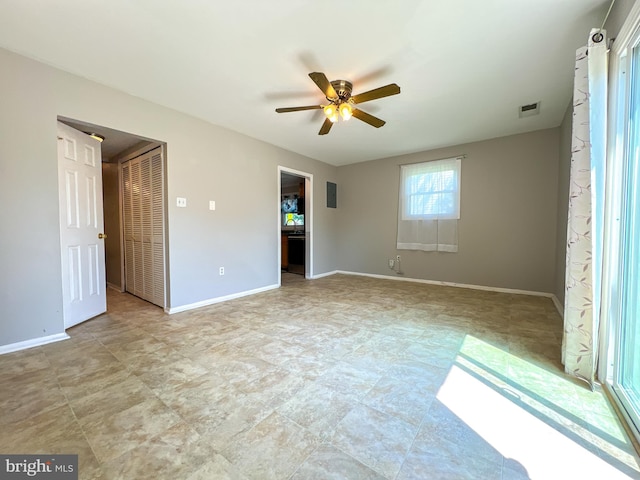 131 Arundel Rd, Pasadena, MD 21122 - unfurnished bedroom with baseboards, a closet, and a ceiling fan