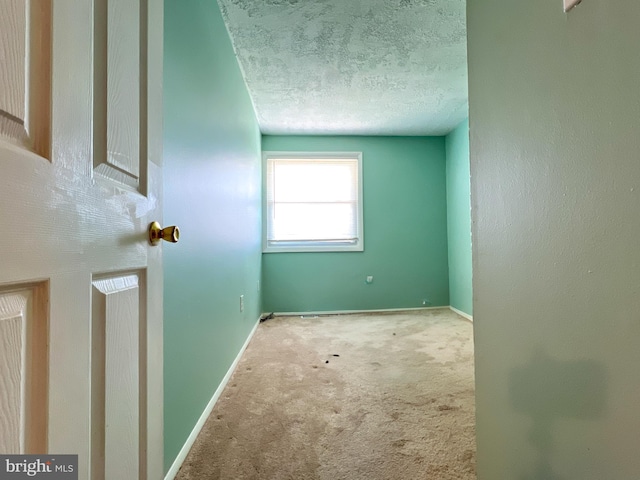 131 Arundel Rd, Pasadena, MD 21122 - carpeted empty room with baseboards and a textured ceiling