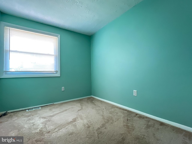 131 Arundel Rd, Pasadena, MD 21122 - carpeted spare room featuring baseboards and a textured ceiling