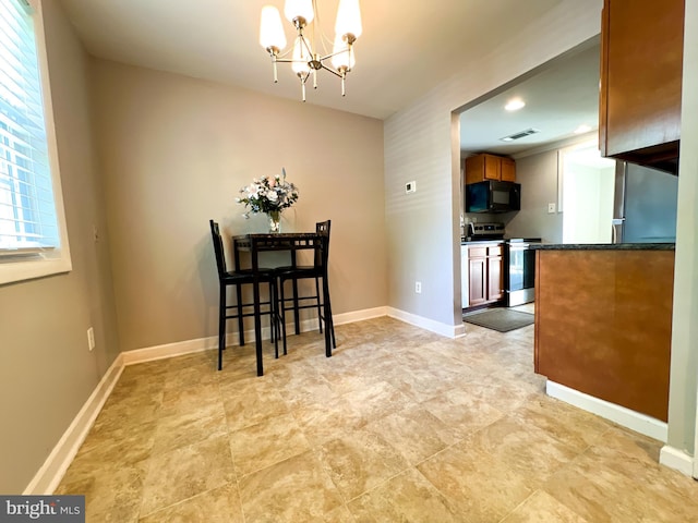 131 Arundel Rd, Pasadena, MD 21122 - dining space featuring a chandelier and baseboards